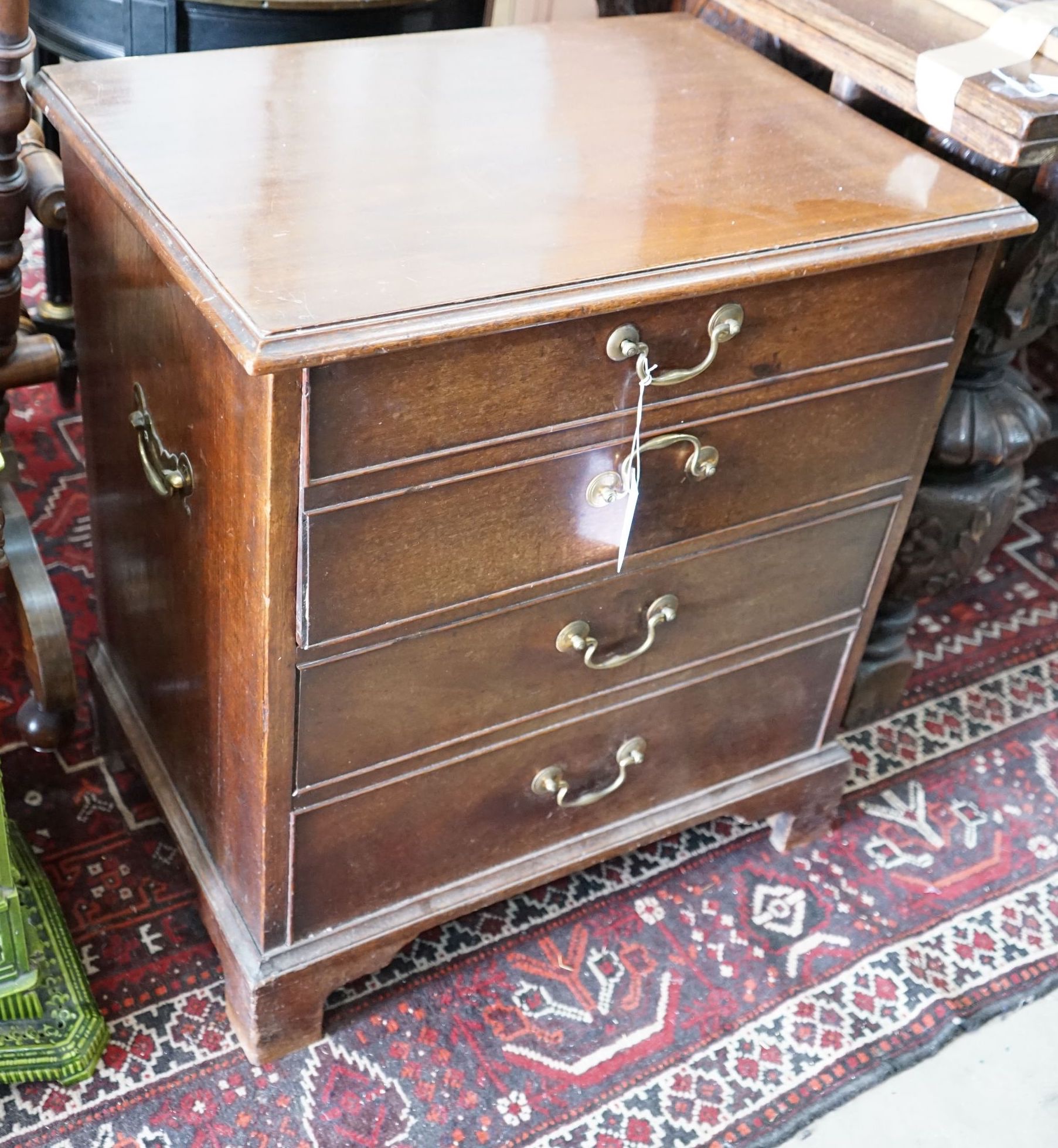 A 19th century mahogany hinged top commode with dummy drawer front, width 65cm, depth 47cm, height 71cm